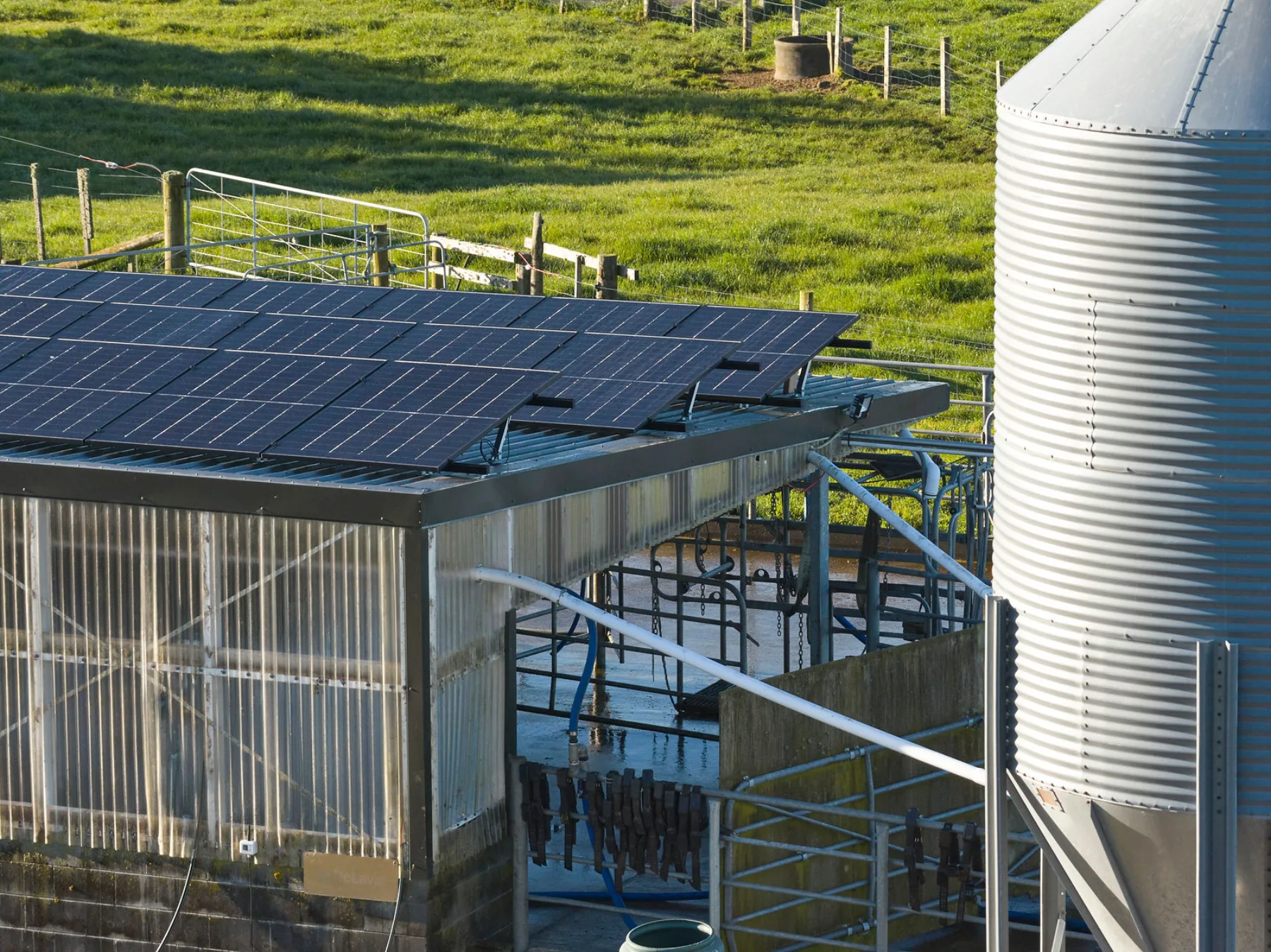Solar on a Taranaki milking shed roof beside the silo