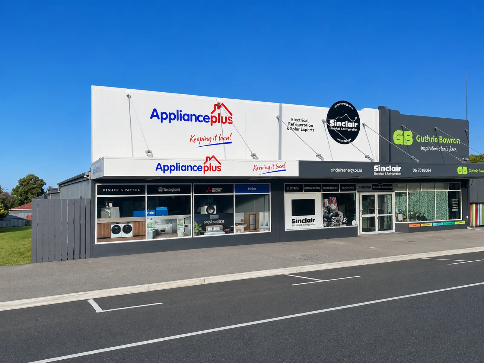 Street frontage of Appliance Plus, Sinclair Electrical, and Guthrie Bowron in Ōpunake
