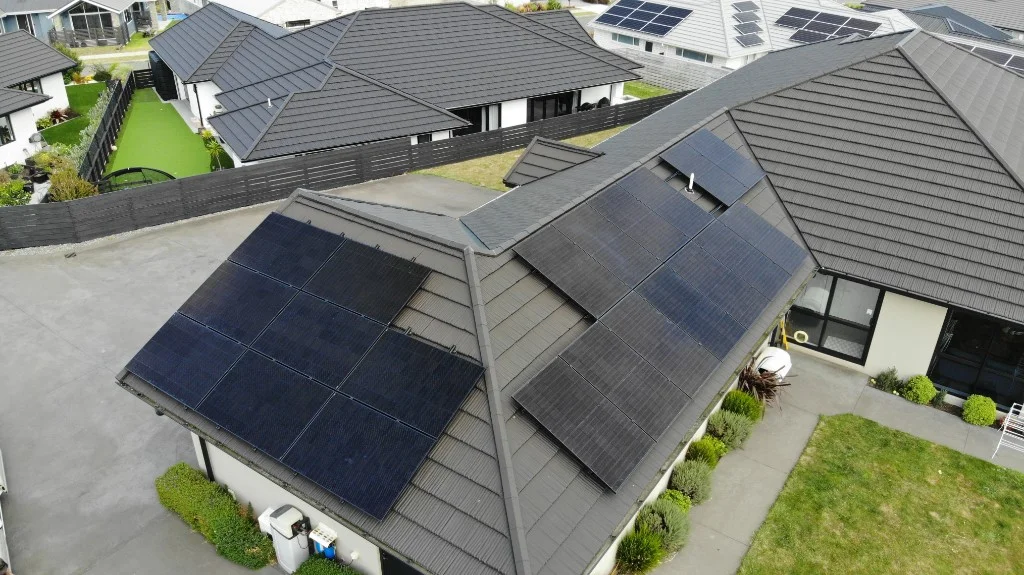 Workshop roof with solar panels and Mount Taranaki in the distance